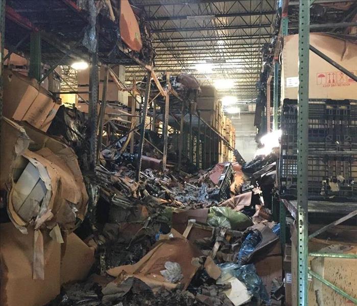 Fire strikes a warehouse and destroys a large amount of product