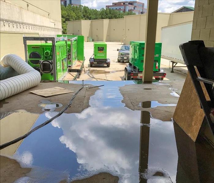 Flood water on the ground of a loading dock of a Murfreesboro business