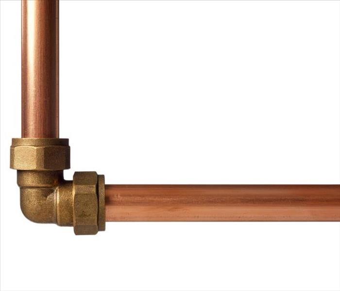 Copper pipe on white with connector