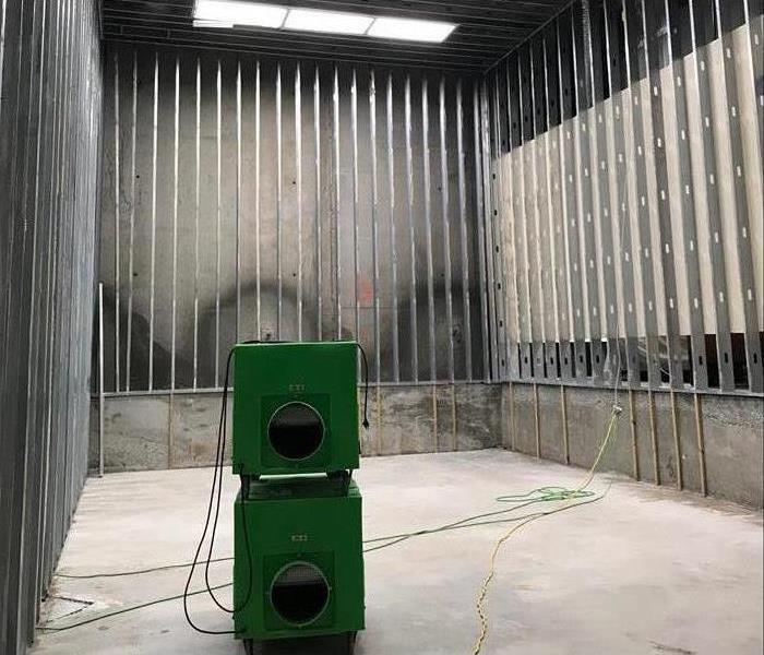 Two air scrubbers inside a building. 